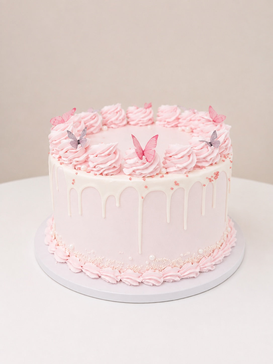 Pink Drip Cake with Edible Butterflies