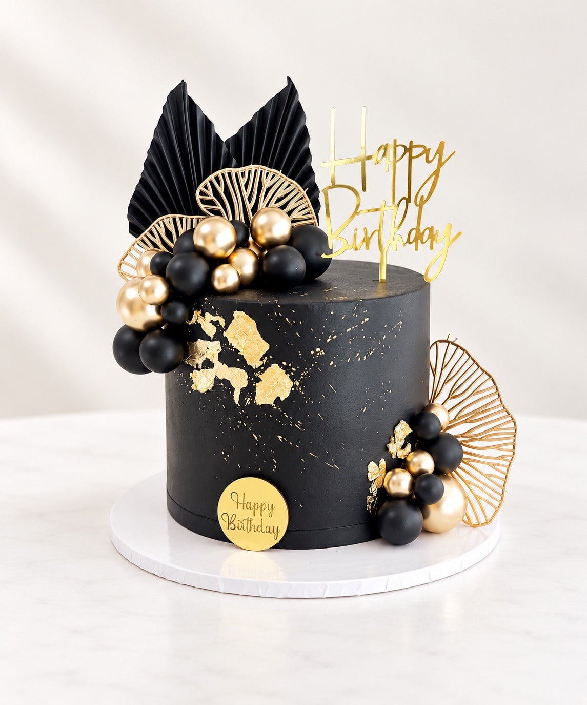 Smooth Black Cake with Gold & Black Accents