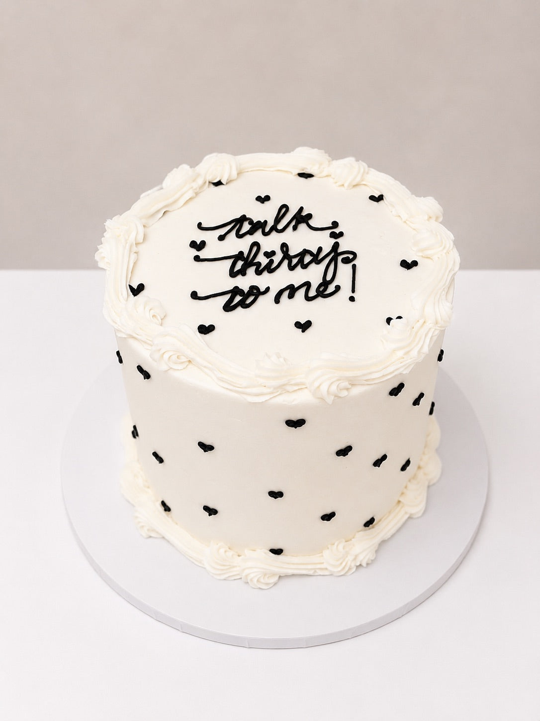 Buttercream Cake with Black Hearts