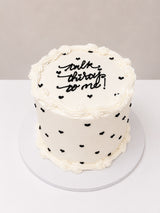 Buttercream Cake with Black Hearts