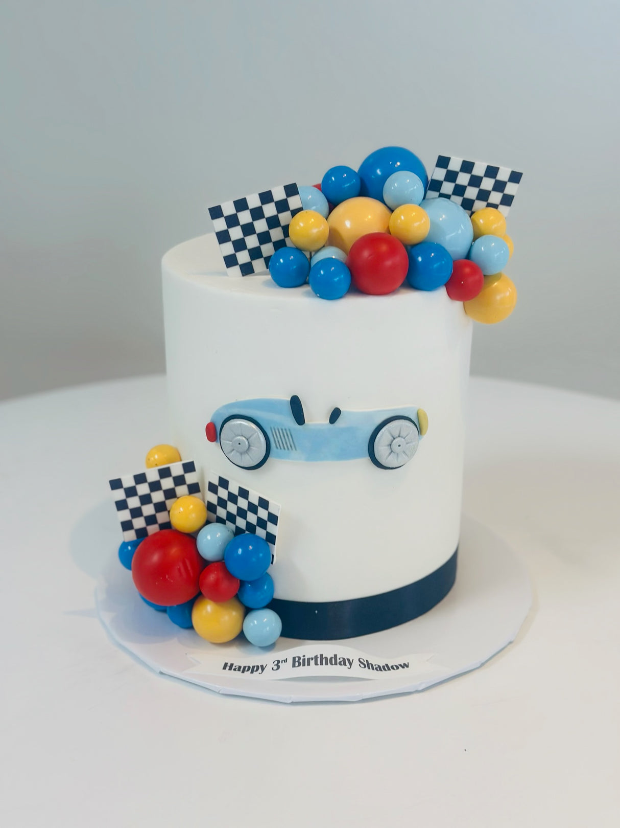 Customized Cake (Tall Racecar Design with Buttercream, Edible Images, and Fondant Accents)