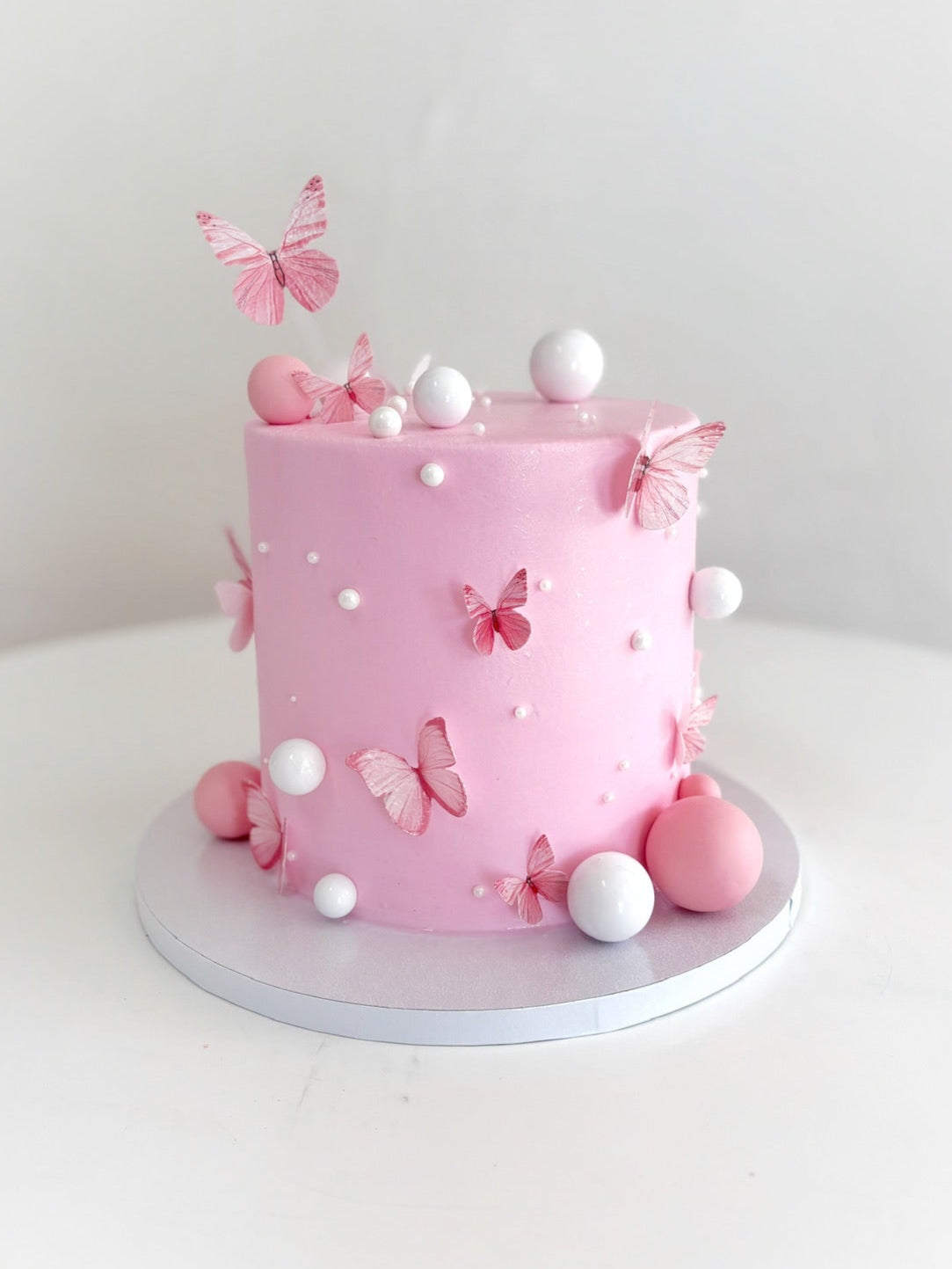 Pink Cake with Edible Butterflies