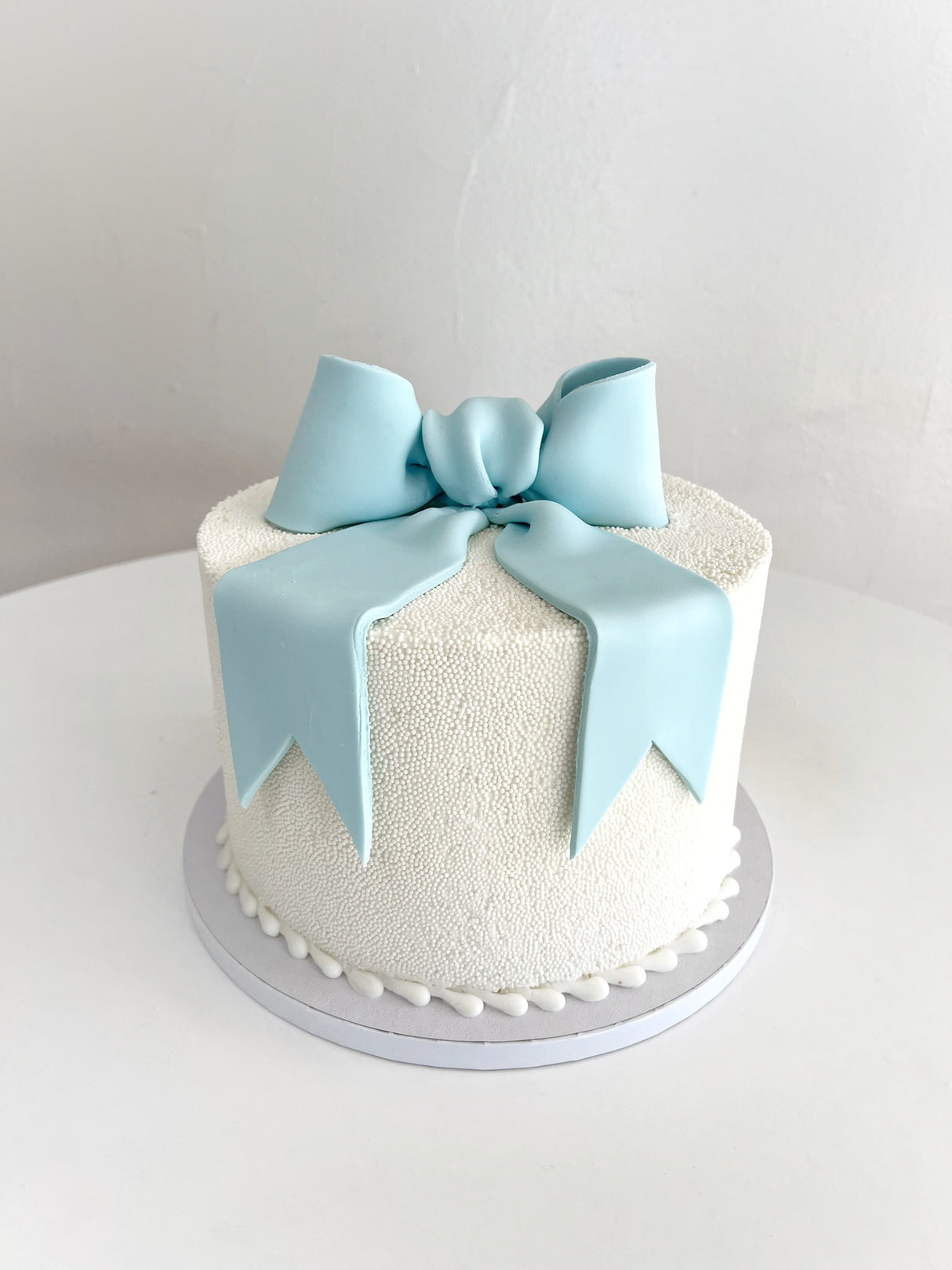 Customized Cake (Smooth Design with Buttercream, Nonpareils, and Fondant Bow)